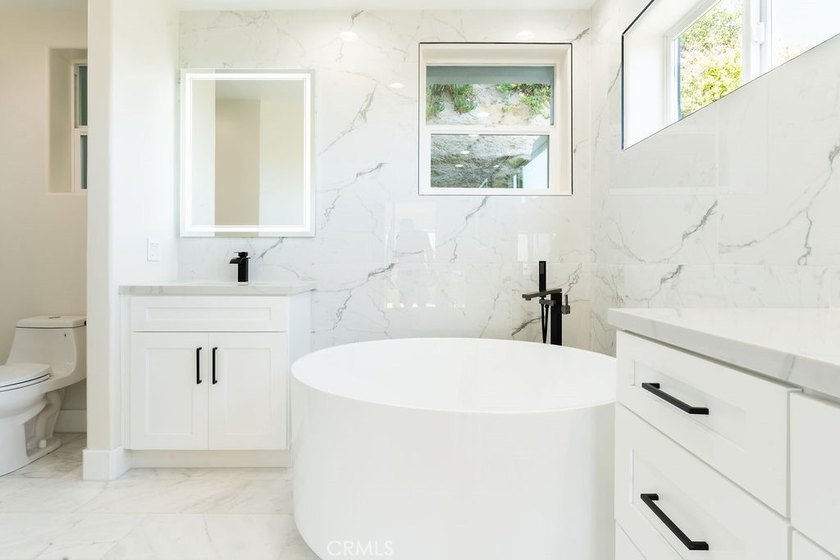 This newly renovated home with breathtaking 180-degree ocean - photo 48