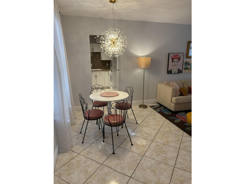 Move right in to this charming THREE bedroom condominium, in the - photo 2