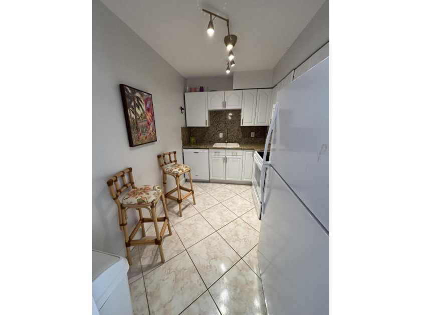 Move right in to this charming THREE bedroom condominium, in the - photo 3