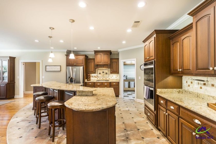 Welcome home to this stunning custom-built, four-sided brick - photo 8