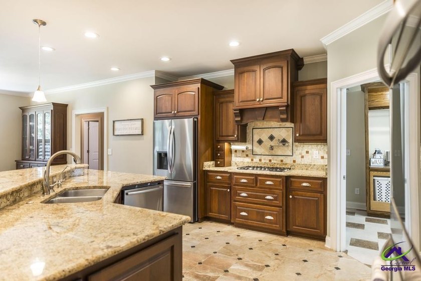 Welcome home to this stunning custom-built, four-sided brick - photo 9