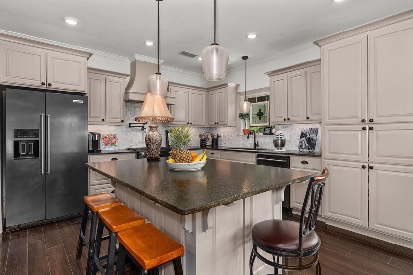 Step into a home where custom craftsmanship, exceptional storage - photo 9