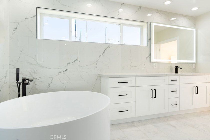 This newly renovated home with breathtaking 180-degree ocean - photo 47