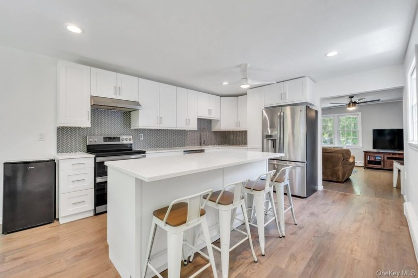 This sprawling and expanded Cape is set on an exceptional .75 - photo 17