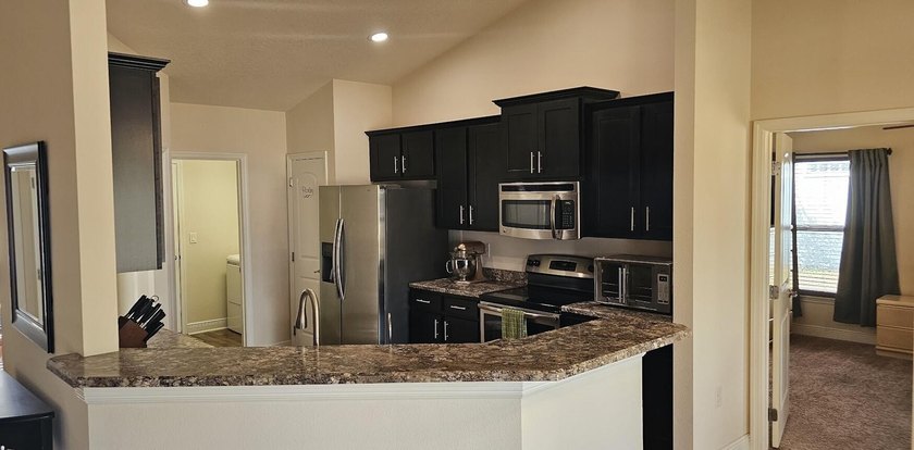 Welcome to a home with unbeatable location. Built in 2015, this - photo 7