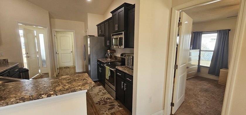 Welcome to a home with unbeatable location. Built in 2015, this - photo 8