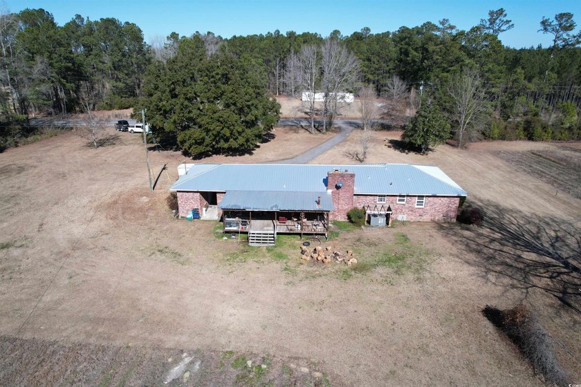 Lovely brick ranch-style home with just over 12 acres! Through - photo 31