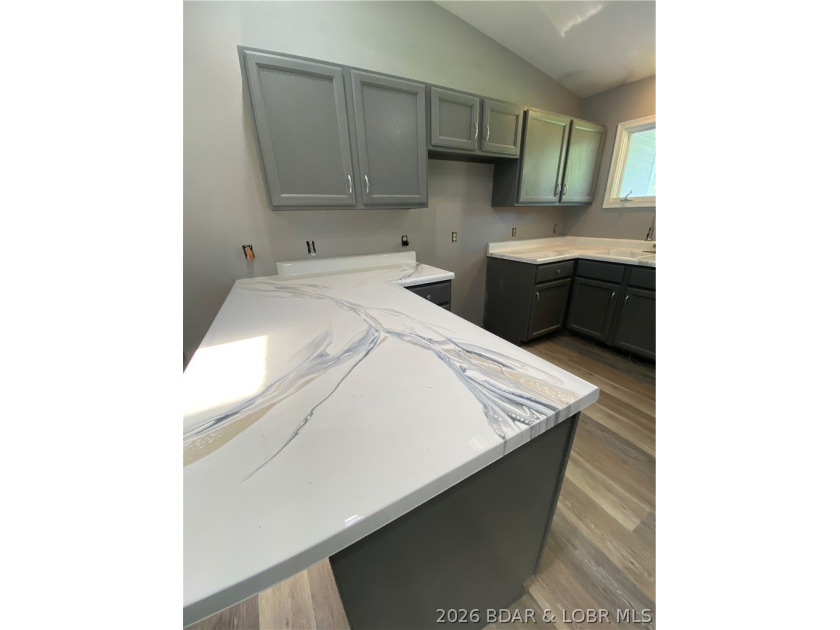 This home checks a lot of boxes: Location, blacktop to your door - photo 15
