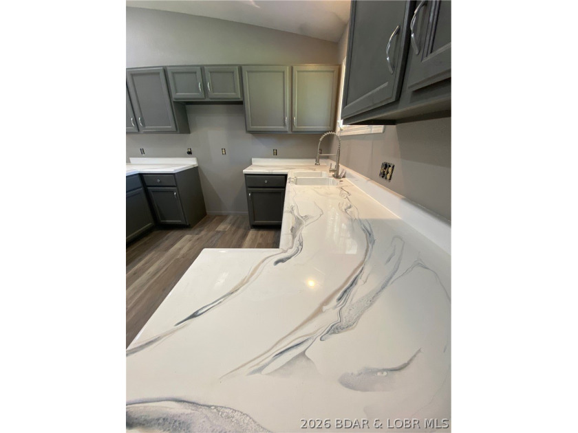 This home checks a lot of boxes: Location, blacktop to your door - photo 17