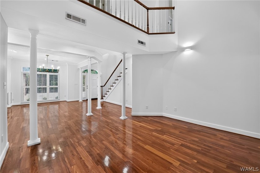 Nestled on a wooded golf course lot in the sought-after - photo 12