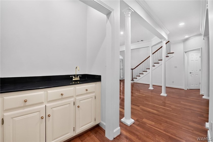 Nestled on a wooded golf course lot in the sought-after - photo 13