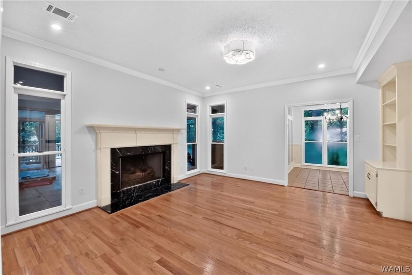 Nestled on a wooded golf course lot in the sought-after - photo 16