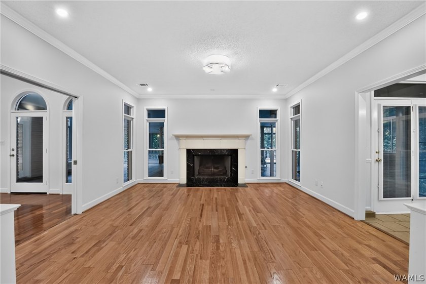 Nestled on a wooded golf course lot in the sought-after - photo 17