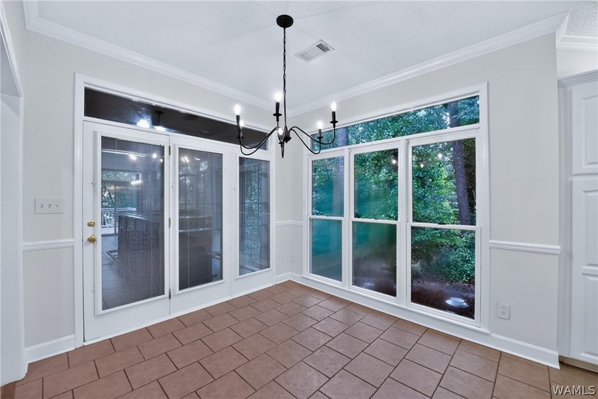Nestled on a wooded golf course lot in the sought-after - photo 20