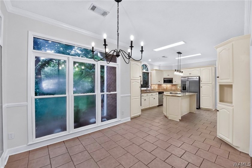 Nestled on a wooded golf course lot in the sought-after - photo 21