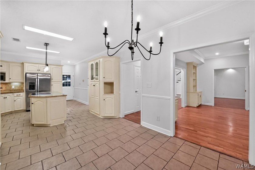 Nestled on a wooded golf course lot in the sought-after - photo 22