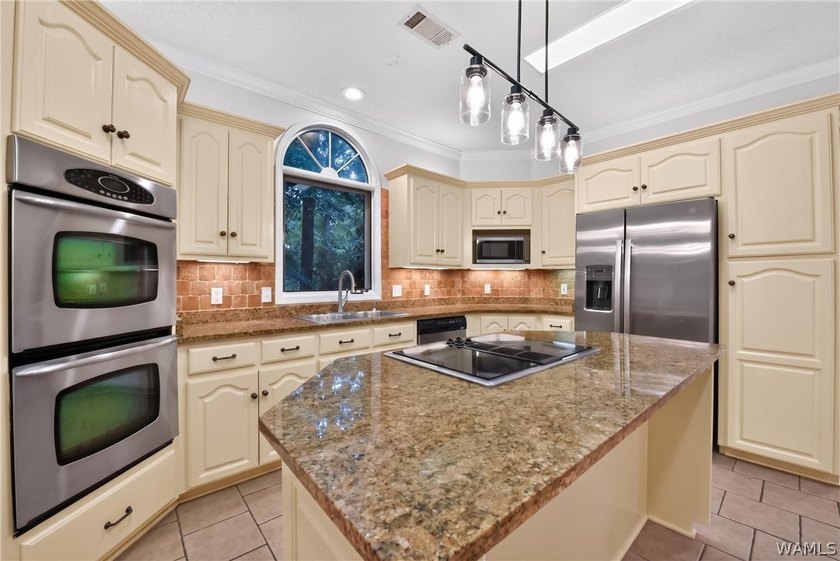 Nestled on a wooded golf course lot in the sought-after - photo 23