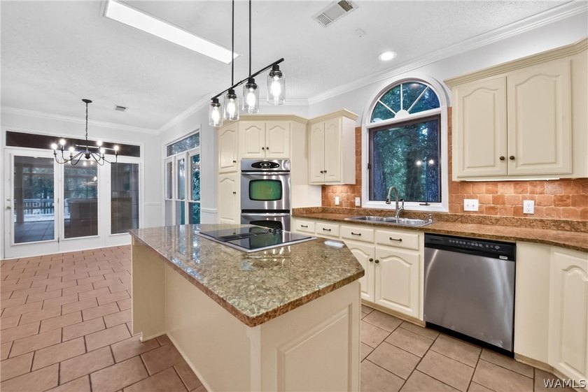 Nestled on a wooded golf course lot in the sought-after - photo 24
