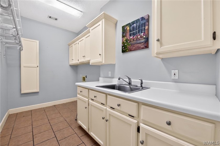 Nestled on a wooded golf course lot in the sought-after - photo 28