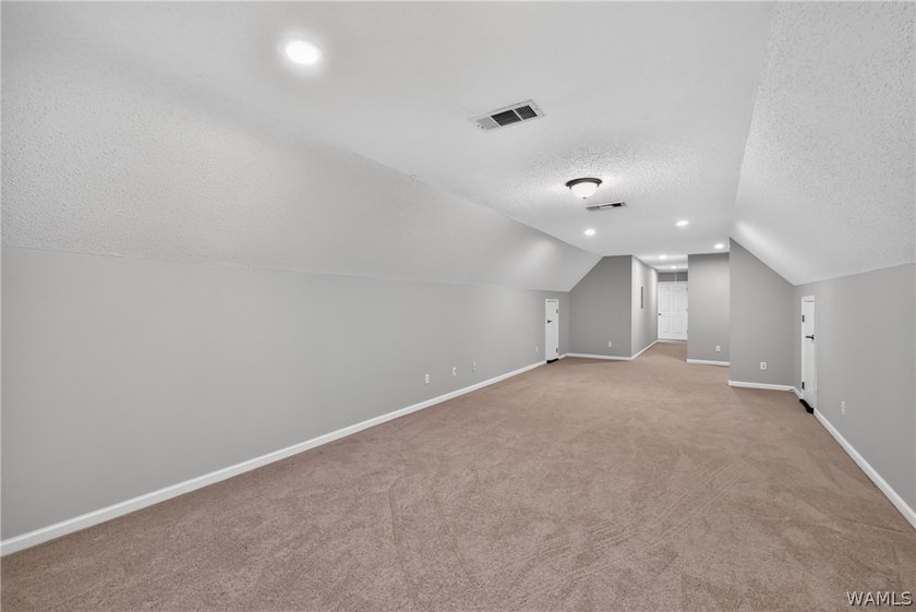 Nestled on a wooded golf course lot in the sought-after - photo 46