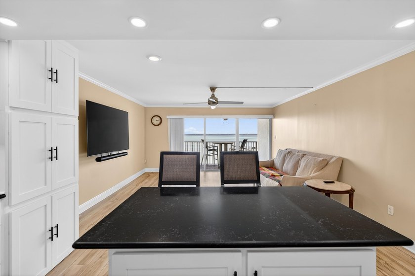 Rare opportunity to own a 3rd-floor end unit in the gated - photo 12