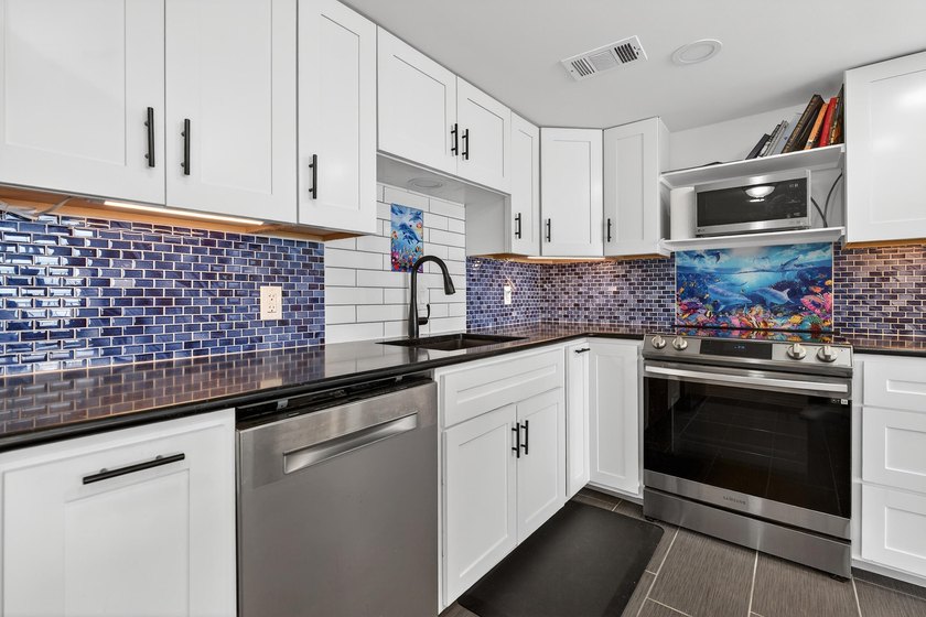 Rare opportunity to own a 3rd-floor end unit in the gated - photo 13