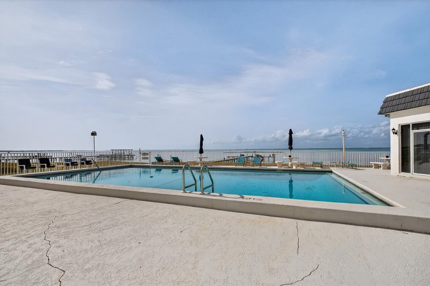 Rare opportunity to own a 3rd-floor end unit in the gated - photo 33
