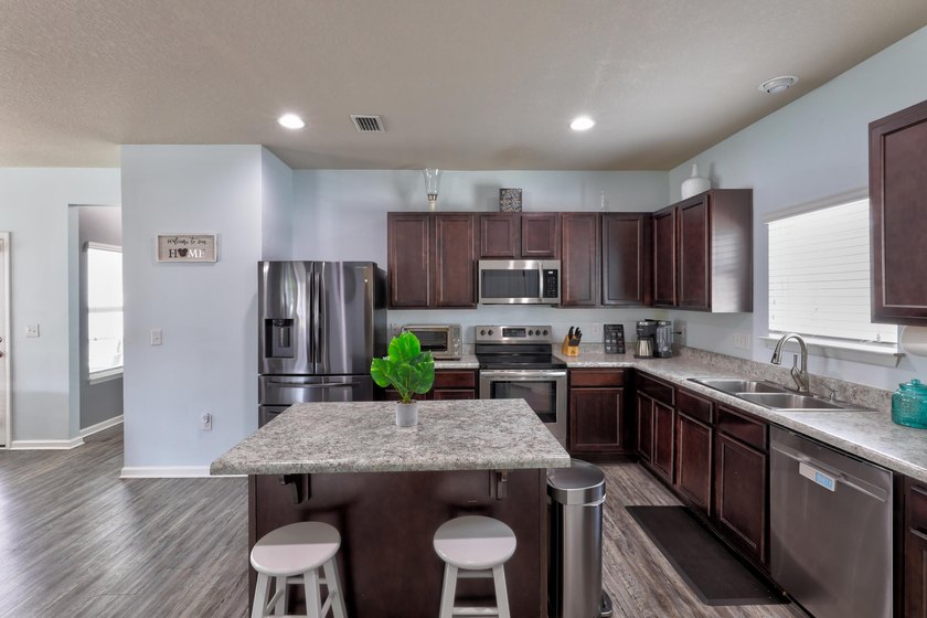 Welcome to this beautiful 4-bedroom, 3-bath home located in the - photo 15