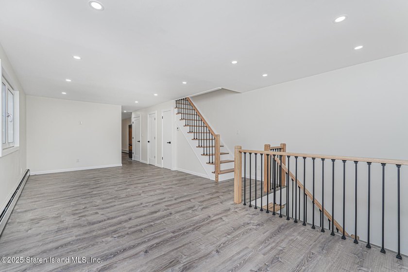 'This elegant 2 Family home features a sophisticated stocco and - photo 11