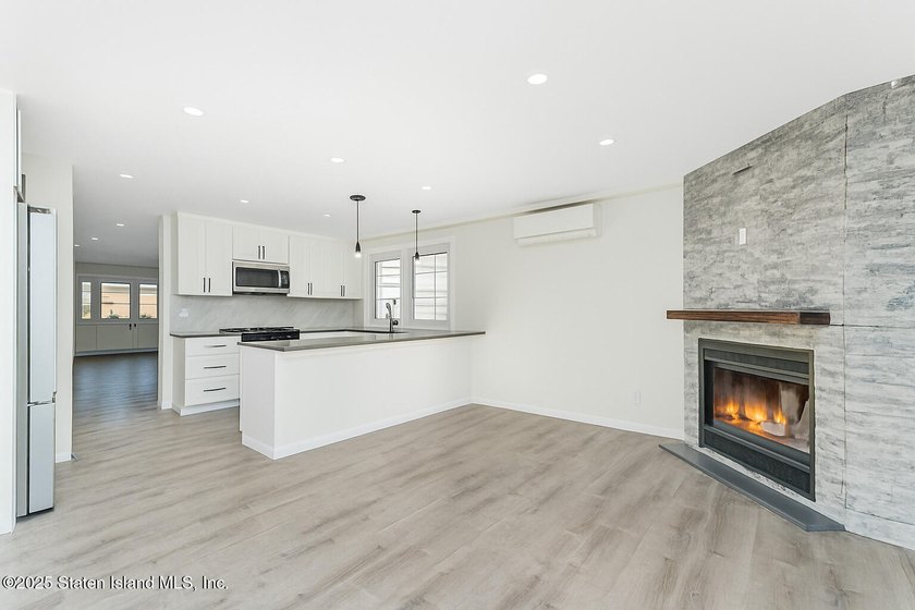 'This elegant 2 Family home features a sophisticated stocco and - photo 15