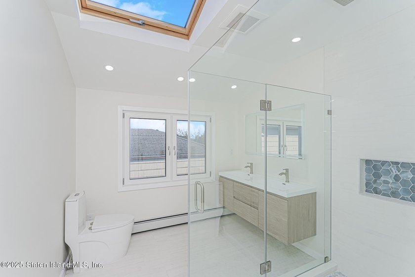 'This elegant 2 Family home features a sophisticated stocco and - photo 24