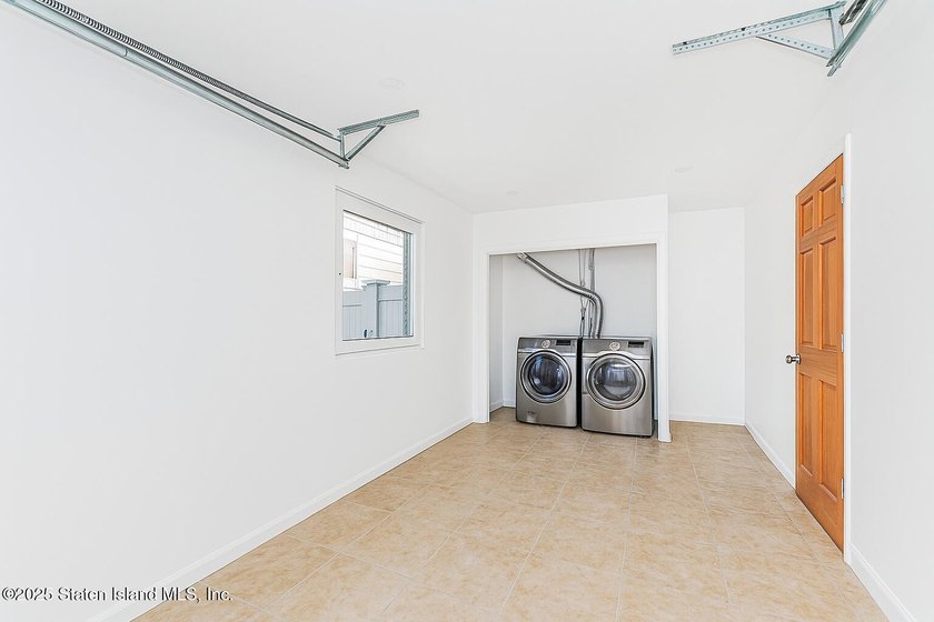 'This elegant 2 Family home features a sophisticated stocco and - photo 29
