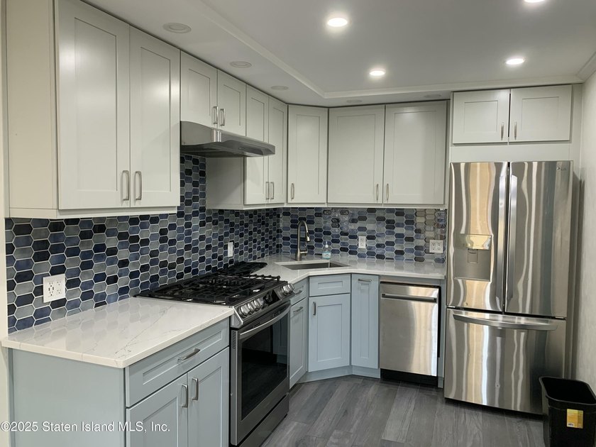'This elegant 2 Family home features a sophisticated stocco and - photo 34