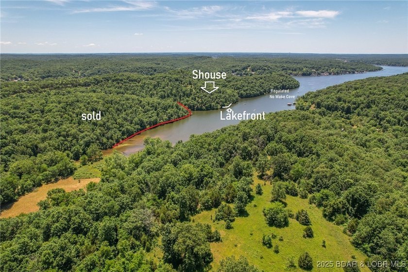 Spacious 1.20 acres and 80' of lakefront in a reg no wake cove - photo 31