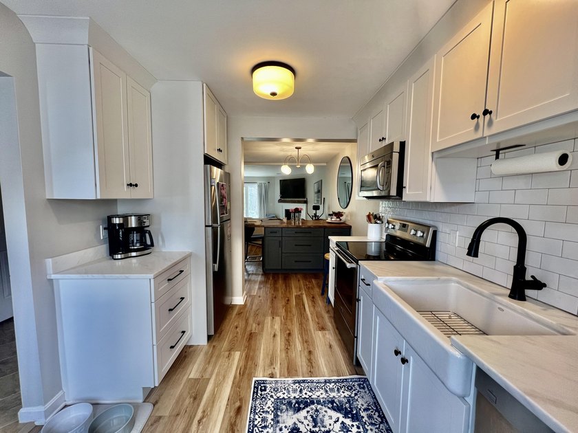 Enjoy serene pond views from this sunny and beautifully updated - photo 3
