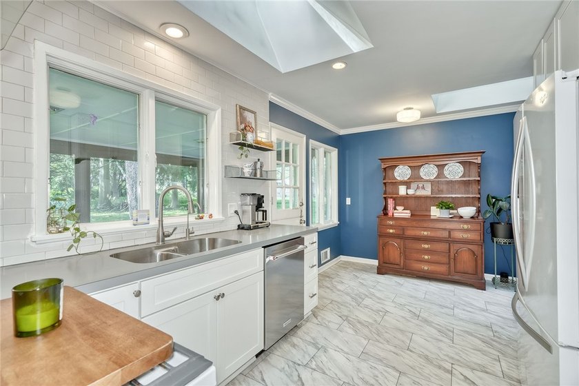 Welcome home to this beautifully updated 4-bedroom, 2-bath - photo 13