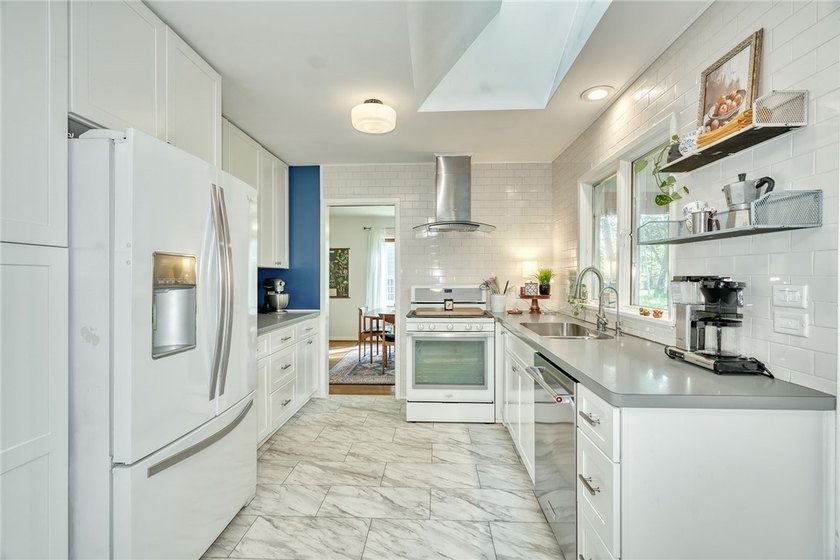 Welcome home to this beautifully updated 4-bedroom, 2-bath - photo 17