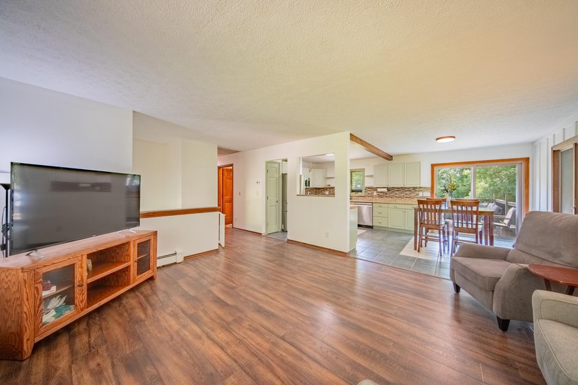 Nestled on over two acres in peaceful Grass Lake, this - photo 12