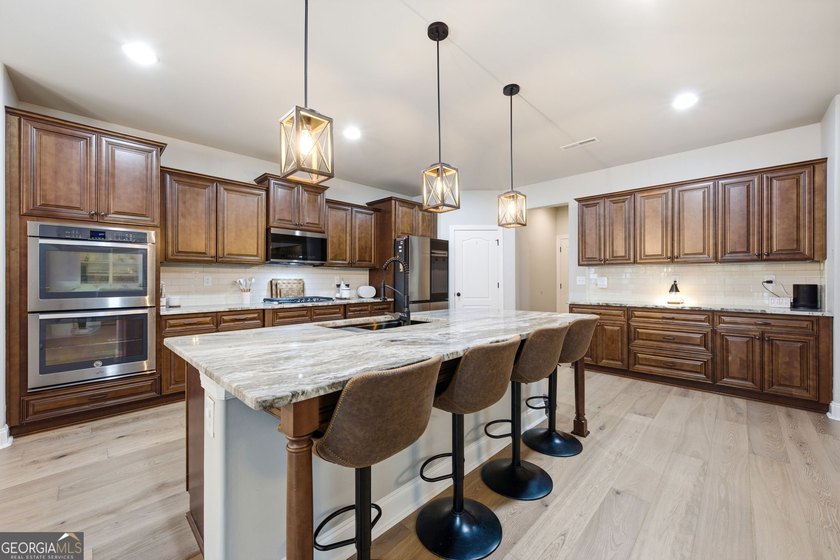 Welcome to 122 Brooks Landing, an exceptional 5-bedroom, 5 - photo 20
