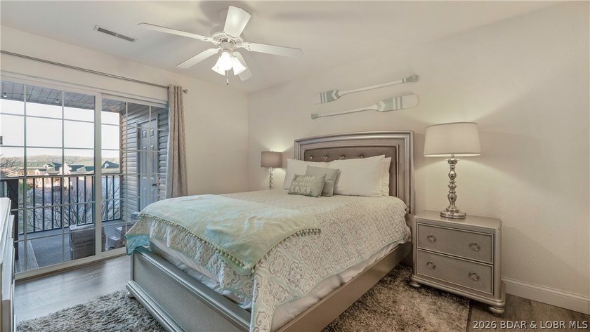Wake up to peaceful cove views from your screened deck at this - photo 13