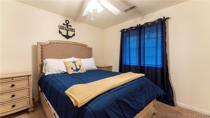Wake up to peaceful cove views from your screened deck at this - photo 16