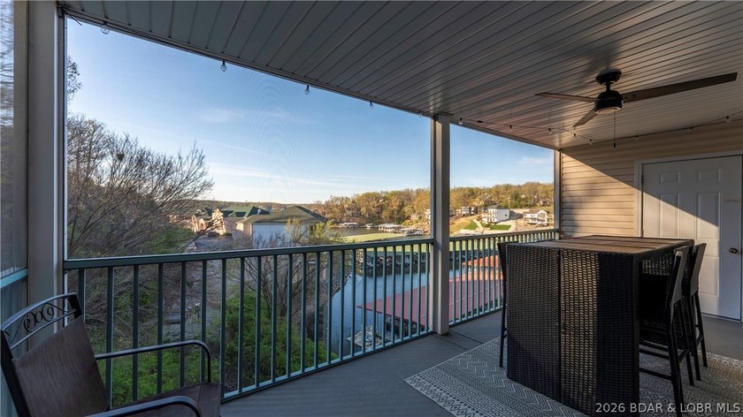 Wake up to peaceful cove views from your screened deck at this - photo 19