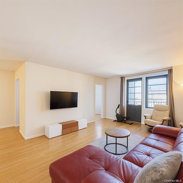 This sun-filled residence features a private balcony and windows - photo 2
