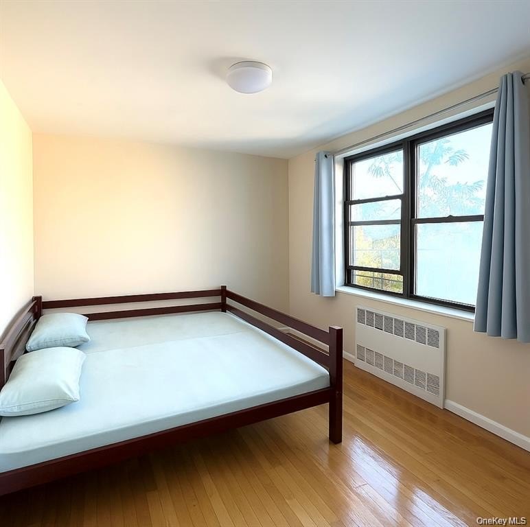 This sun-filled residence features a private balcony and windows - photo 9
