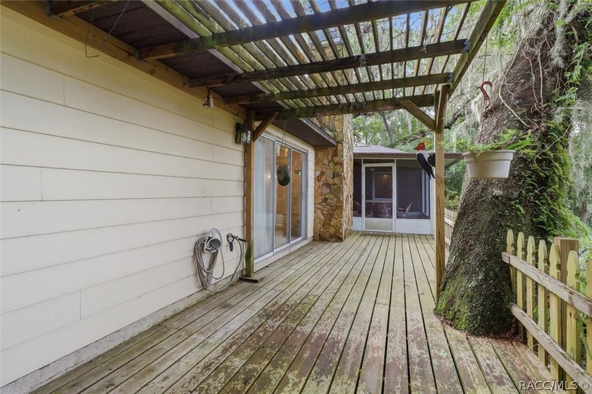 Nestled beneath a canopy of majestic oak trees and overlooking - photo 34