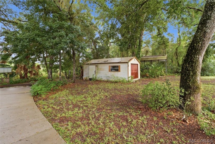 Nestled beneath a canopy of majestic oak trees and overlooking - photo 42