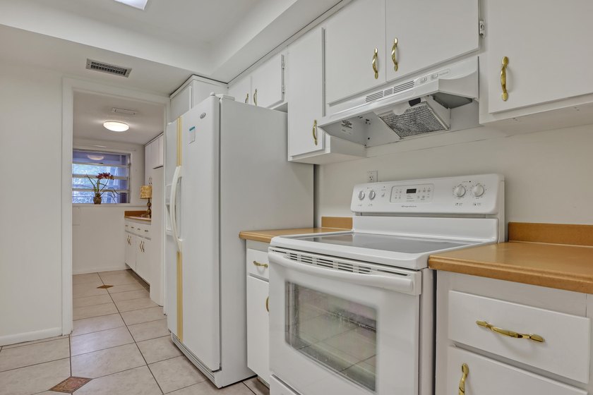 Step into this inviting two-bedroom, two-bathroom condo, where - photo 13