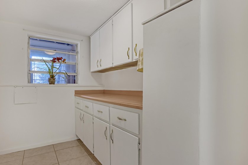 Step into this inviting two-bedroom, two-bathroom condo, where - photo 17