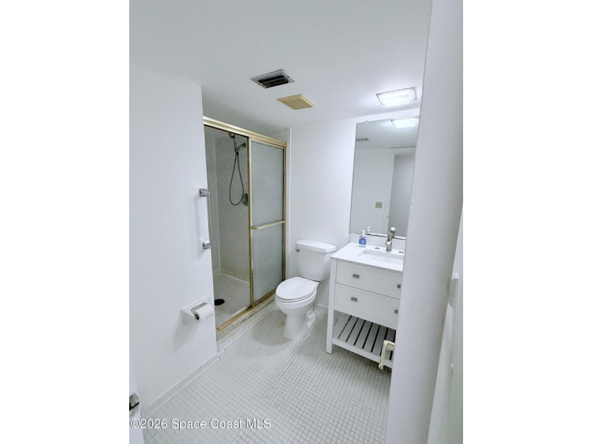 Step into this inviting two-bedroom, two-bathroom condo, where - photo 18