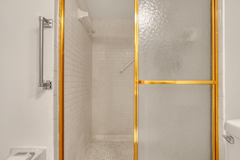 Step into this inviting two-bedroom, two-bathroom condo, where - photo 27